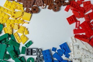 Images displays Lego bricks of different colours and shapes and size.